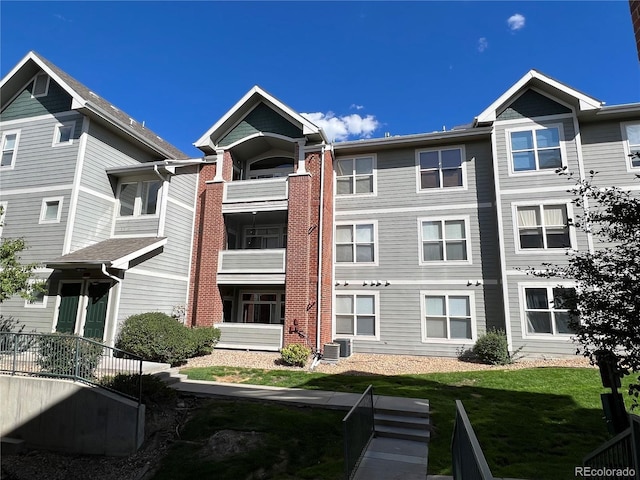 14201 E 1st Dr Unit 104, Aurora, CO 80011 - view of building exterior with central air condition unit