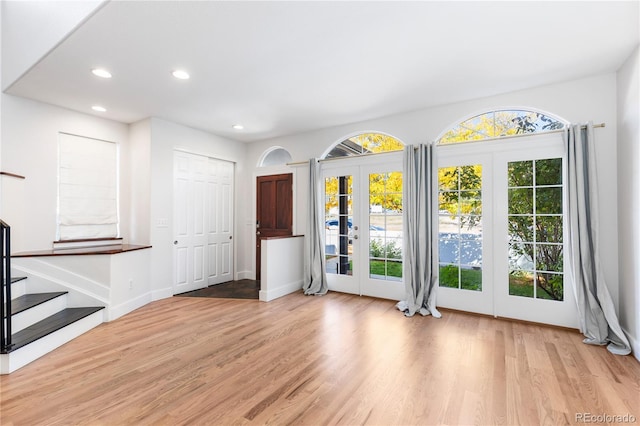 interior space featuring light wood-type flooring and french doors