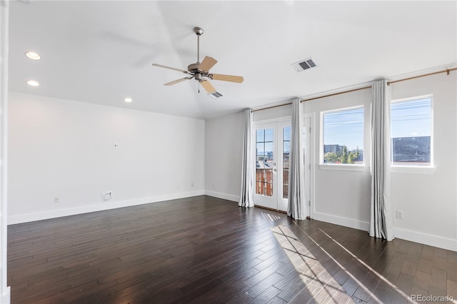 unfurnished room featuring ceiling fan and dark hardwood / wood-style flooring