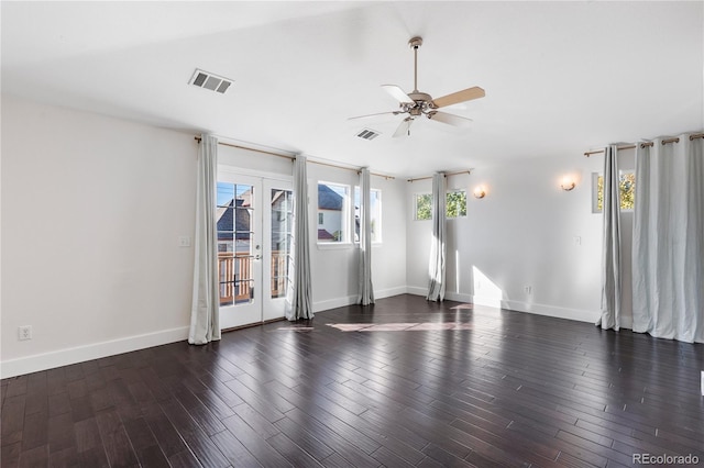 spare room with ceiling fan, french doors, and dark hardwood / wood-style flooring