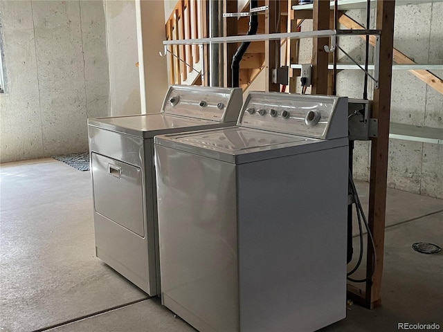 laundry room with separate washer and dryer and laundry area