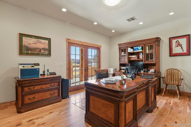 home office featuring recessed lighting, visible vents, baseboards, french doors, and light wood-type flooring