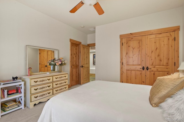 carpeted bedroom with ceiling fan