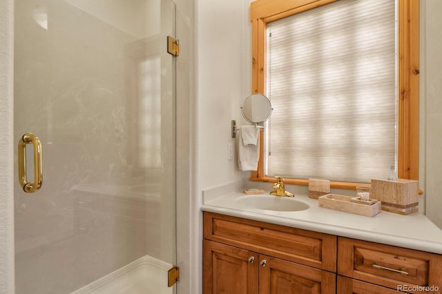 full bath featuring a stall shower and vanity