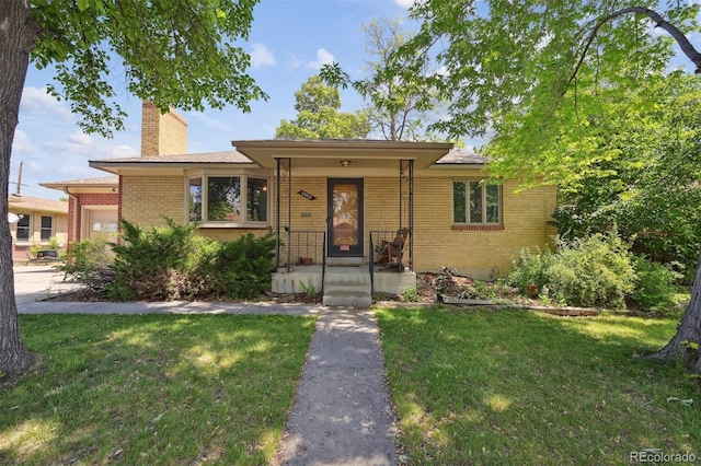 6050 Marshall Ct, Arvada, CO 80003 - single story home with brick siding, a chimney, and a front lawn
