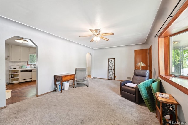 6050 Marshall Ct, Arvada, CO 80003 - living area featuring arched walkways, carpet flooring, healthy amount of natural light, and ceiling fan