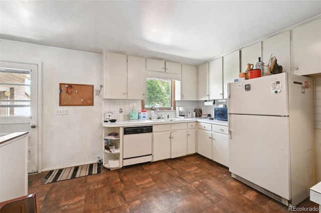 6050 Marshall Ct, Arvada, CO 80003 - kitchen featuring white appliances, light countertops, decorative backsplash, and a sink