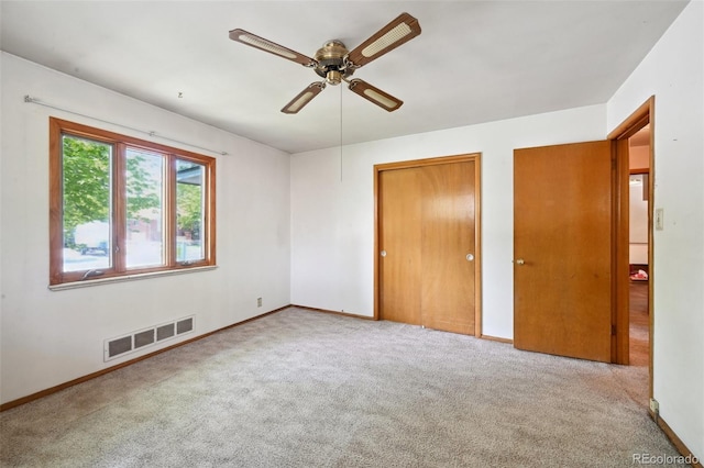 6050 Marshall Ct, Arvada, CO 80003 - unfurnished bedroom featuring carpet, two closets, baseboards, and ceiling fan