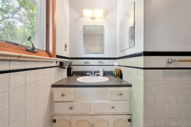 6050 Marshall Ct, Arvada, CO 80003 - bathroom with vanity, tile walls, and wainscoting