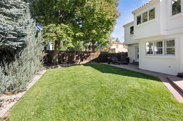 view of yard featuring a patio area and fence
