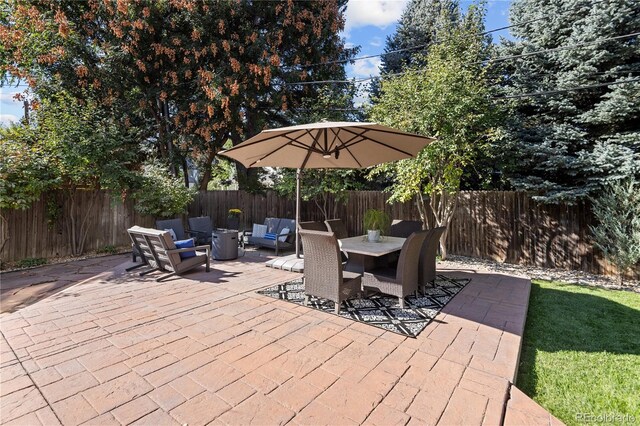 deck with a fenced backyard, a patio area, and outdoor dining space