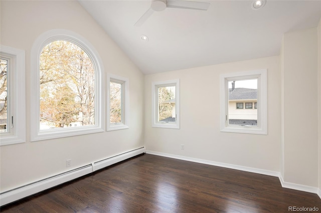 spare room with lofted ceiling, recessed lighting, a baseboard heating unit, ceiling fan, and dark wood-style floors