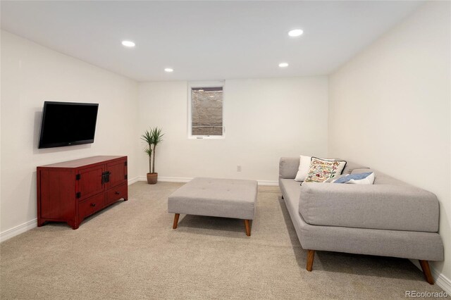 living room with light carpet, baseboards, and recessed lighting