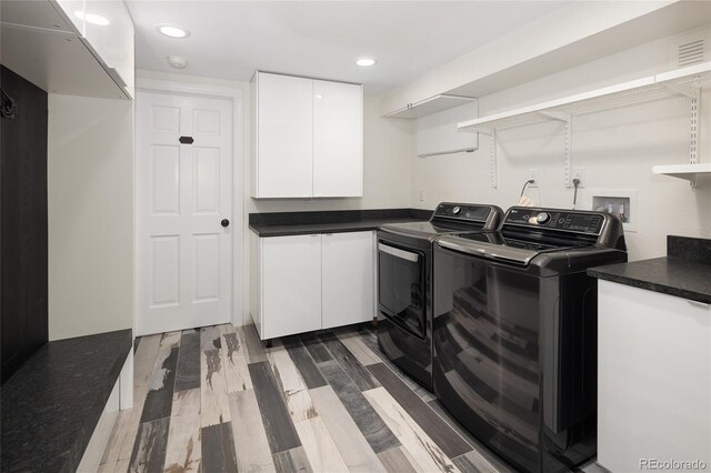 clothes washing area with washing machine and dryer, recessed lighting, cabinet space, and dark wood finished floors