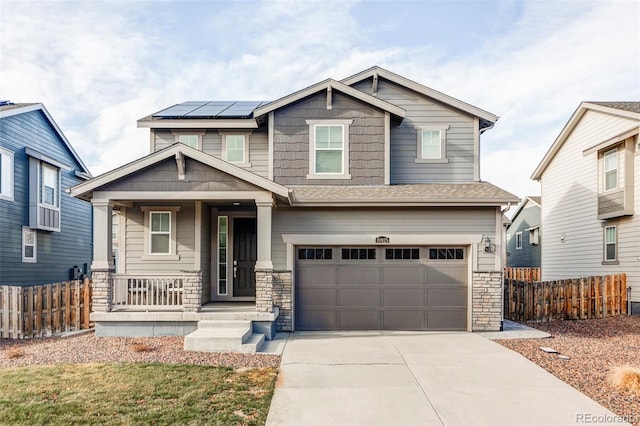 craftsman inspired home with a porch and a garage