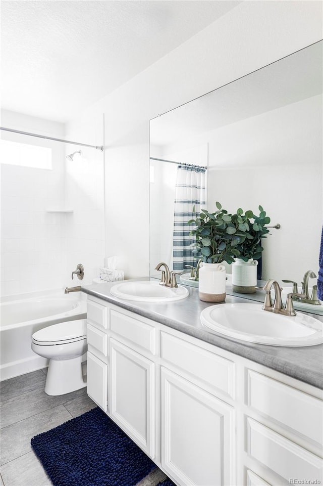 full bathroom featuring vanity, shower / bath combination with curtain, and toilet