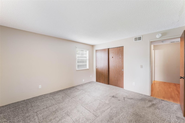 4896 S Dudley St Unit 4-7, Littleton, CO 80123 - unfurnished bedroom with carpet and a closet