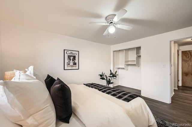 bedroom featuring a ceiling fan, dark wood-style floors, and baseboards