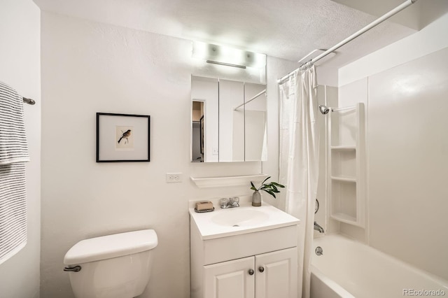 bathroom with vanity, toilet, shower / bath combo with shower curtain, and a textured ceiling