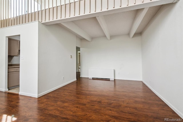 384 S Ironton St Unit 413, Aurora, CO 80012 - empty room with beamed ceiling, baseboards, and wood finished floors