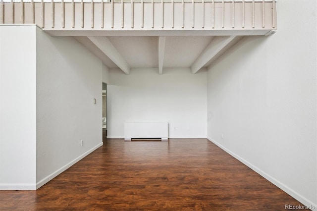 384 S Ironton St Unit 413, Aurora, CO 80012 - empty room featuring beamed ceiling, wood finished floors, and baseboards
