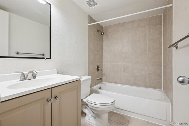384 S Ironton St Unit 413, Aurora, CO 80012 - bathroom with toilet, vanity, shower / washtub combination, tile patterned flooring, and a textured wall