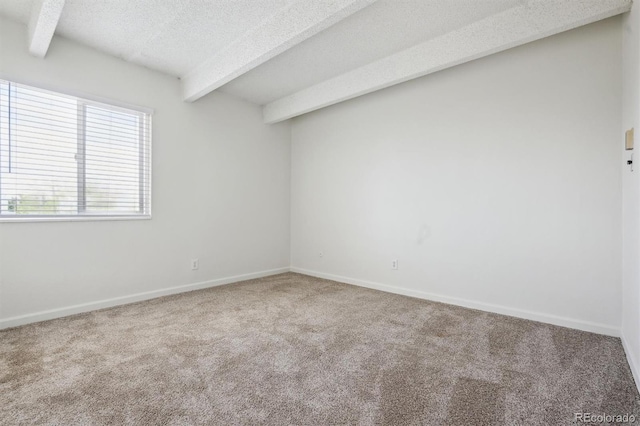 384 S Ironton St Unit 413, Aurora, CO 80012 - carpeted empty room with beam ceiling, a textured ceiling, and baseboards
