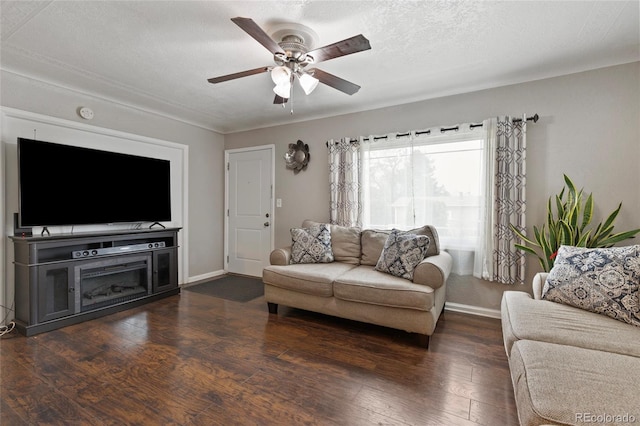5910 Glencoe St, Commerce City, CO 80022 - living area featuring baseboards, ceiling fan, and dark wood-style floors