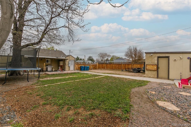 5910 Glencoe St, Commerce City, CO 80022 - view of yard with a trampoline and fence