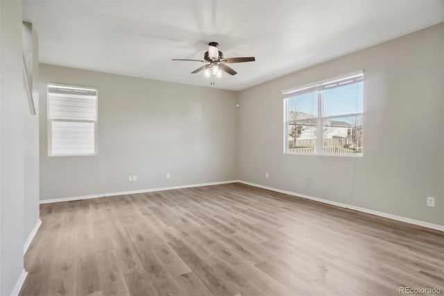 spare room with ceiling fan and light hardwood / wood-style flooring