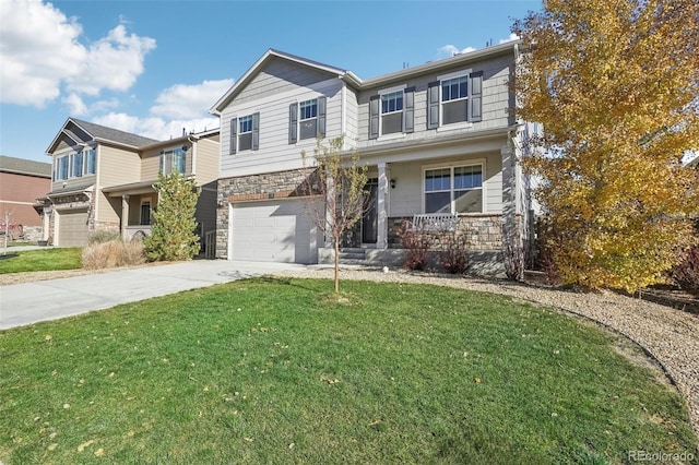 view of front of house with covered porch, a garage, and a front lawn