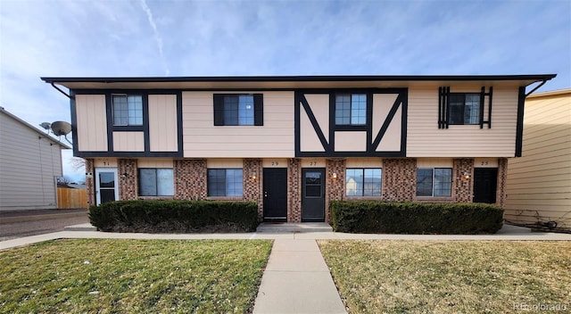 25 Castle Royal Dr, Pueblo, CO 81005 - view of property featuring brick siding and a front lawn