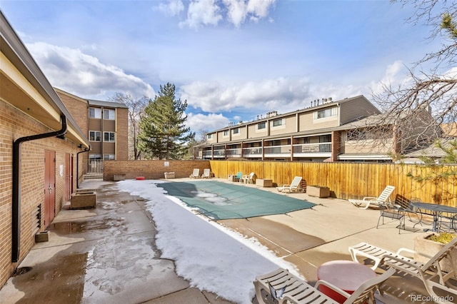 pool featuring a fenced backyard and a patio