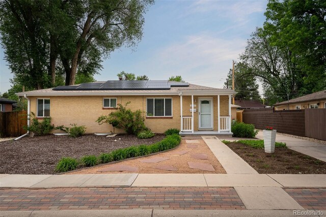 2907 Pennsylvania Ave, Colorado Springs, CO 80907 - ranch-style home featuring brick siding and solar panels