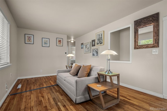 2907 Pennsylvania Ave, Colorado Springs, CO 80907 - living area with wood finished floors, baseboards, and healthy amount of natural light