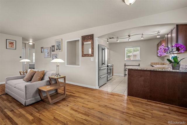 2907 Pennsylvania Ave, Colorado Springs, CO 80907 - living room featuring light wood finished floors and baseboards