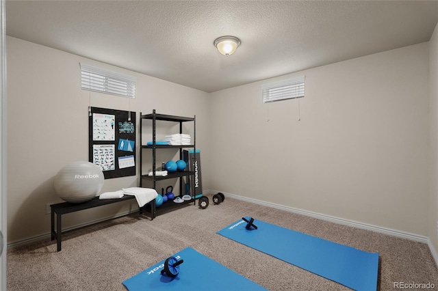 2907 Pennsylvania Ave, Colorado Springs, CO 80907 - exercise area featuring carpet floors, a textured ceiling, and baseboards