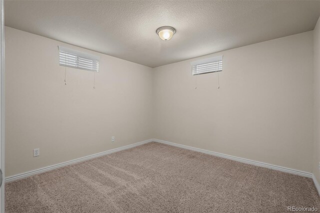 2907 Pennsylvania Ave, Colorado Springs, CO 80907 - below grade area with carpet floors, a textured ceiling, and baseboards