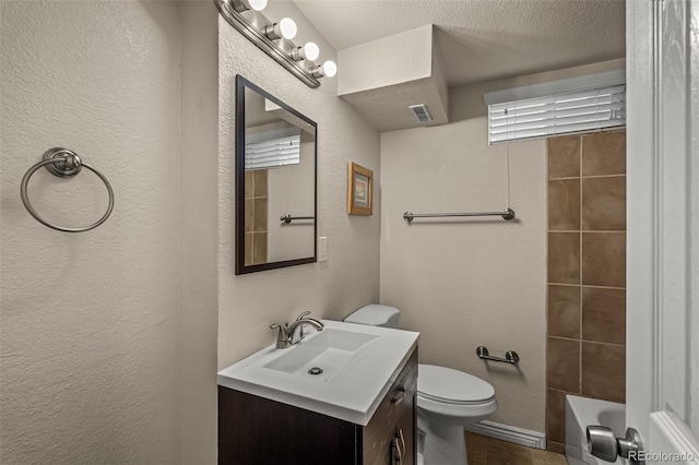 2907 Pennsylvania Ave, Colorado Springs, CO 80907 - full bathroom featuring vanity, toilet, and a textured wall