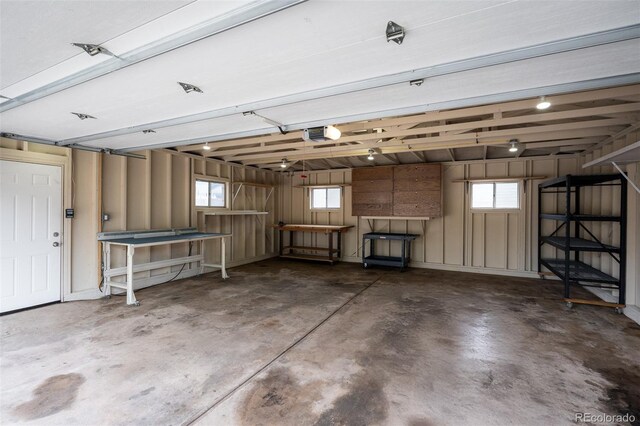 2907 Pennsylvania Ave, Colorado Springs, CO 80907 - garage with a garage door opener and a workshop area