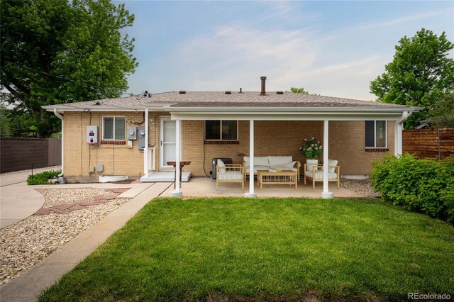 2907 Pennsylvania Ave, Colorado Springs, CO 80907 - rear view of house with a patio, an outdoor living space, and brick siding