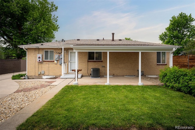2907 Pennsylvania Ave, Colorado Springs, CO 80907 - back of property with a patio area, cooling unit, and brick siding