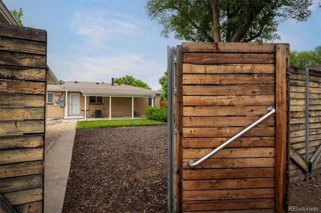 2907 Pennsylvania Ave, Colorado Springs, CO 80907 - gate featuring central AC unit and a patio