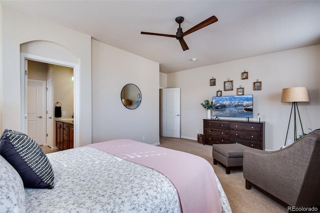 bedroom with light colored carpet, baseboards, and a ceiling fan
