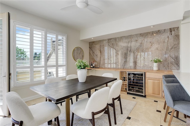 2500 E Cherry Creek S Drive 306, Denver, CO 80209 - dining room featuring beverage cooler, ceiling fan, and a dry bar