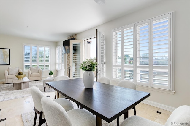 2500 E Cherry Creek S Drive 306, Denver, CO 80209 - dining area featuring light tile patterned floors and baseboards