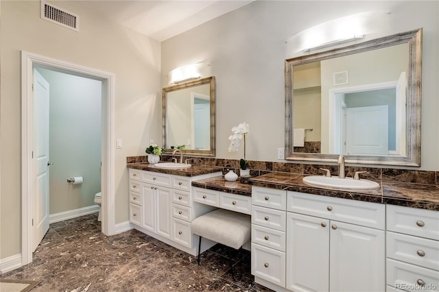 2500 E Cherry Creek S Drive 306, Denver, CO 80209 - bathroom featuring toilet and vanity