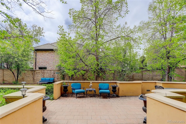 2500 E Cherry Creek S Drive 306, Denver, CO 80209 - fenced backyard featuring a patio area