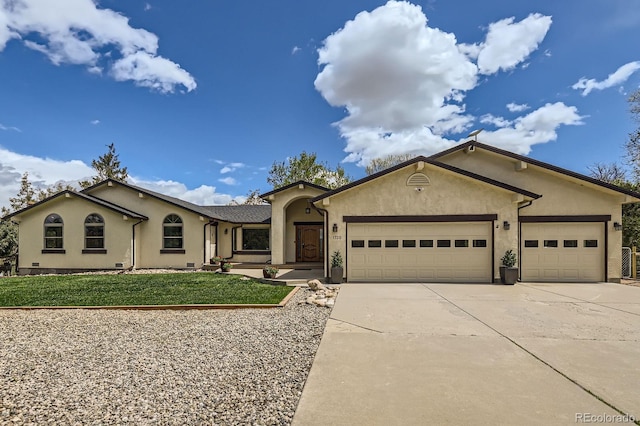ranch-style home with an attached garage, concrete driveway, stucco siding, and a front lawn