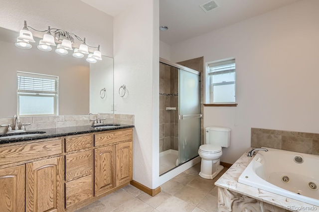 full bath featuring toilet, plenty of natural light, and a sink
